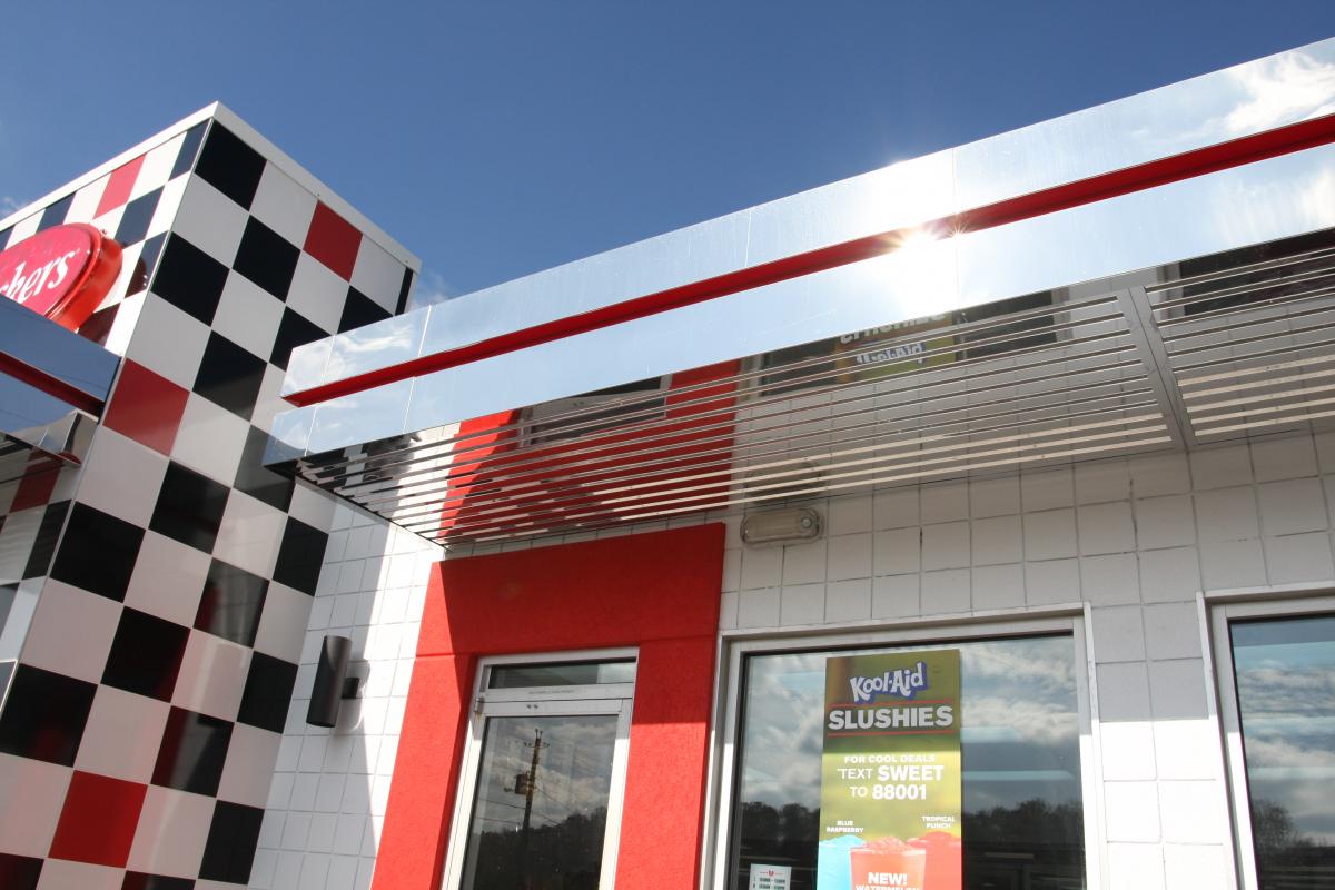 Wow!!!  I told you that it was going to be impressive.  Look at that awning.  Look at the tile.  Look at our red trim around the door.